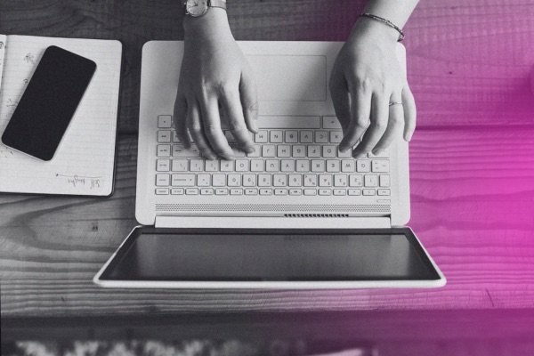 A person typing on a laptop