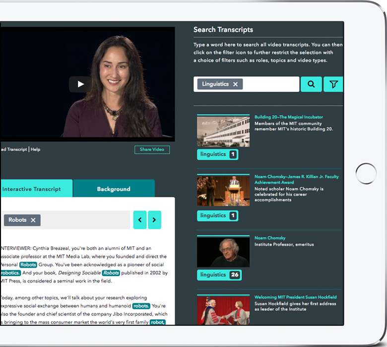 A tablet showing an interview video beside a “Search Transcripts” panel filtered to the tag “Linguistics”, with matching MIT videos listed and the word “robots” highlighted throughout the interactive transcript below.
