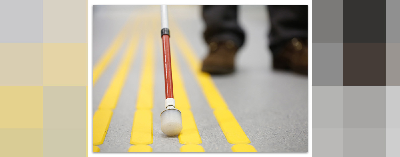 Blind person crossing street.