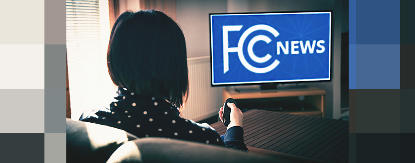 A women watching tv. FCC news on the screen