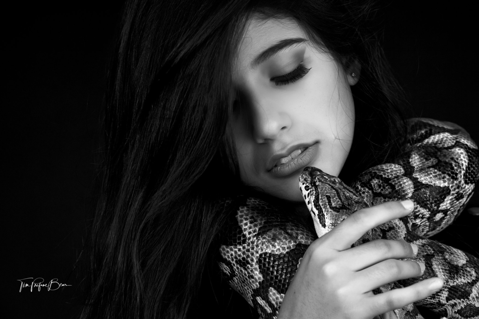 Kaylee Lartigue poses with a snake.