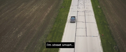 Example of closed captions. Text reads "I'm street smart..." in white text on a black background.