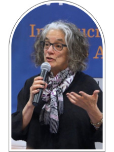 Lainey Feingold holding a microphone