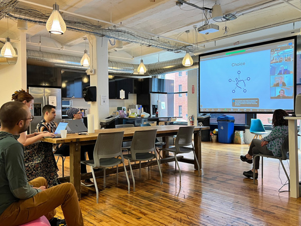 Various 3Play employees viewing a live presentation by Yat Li to celebrate GAAD 2024