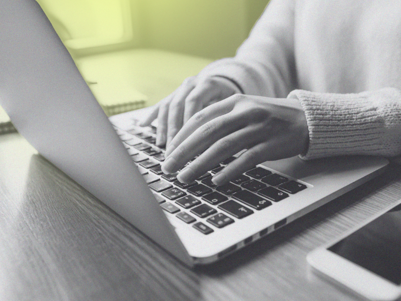 person typing on a laptop