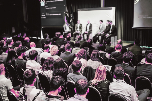 A meeting with a panel presentation
