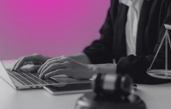 person at laptop with judge's gavel