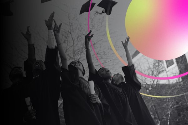 students throwing their caps