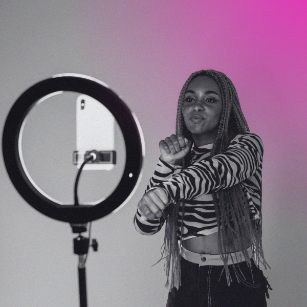 YouTuber creating video with phone and ring light