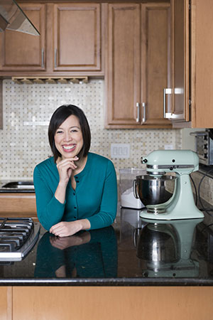 Christine Ha smiling in her kitchen