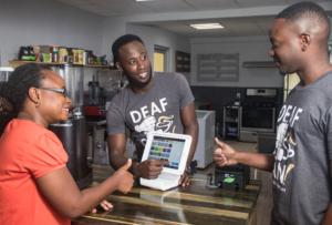 Deaf Can Coffee at the register of their shop