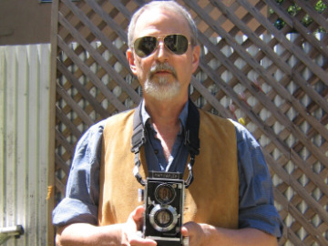 Pete Eckert holding a camera