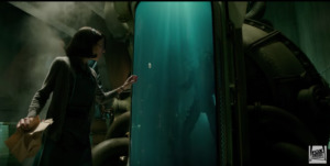 scene from The Shape of Water: woman touches water