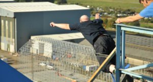 Tony bungee jumping off of a bridge