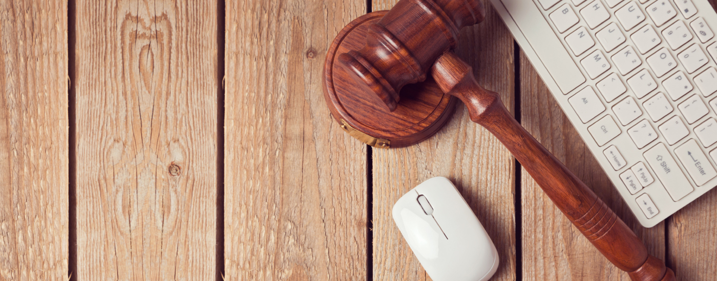 Gavel next to computer mouse and keyboard