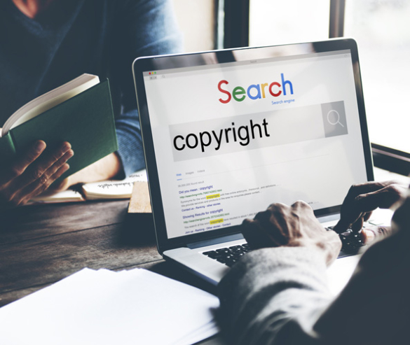 A man search on a search engine the word Copyright