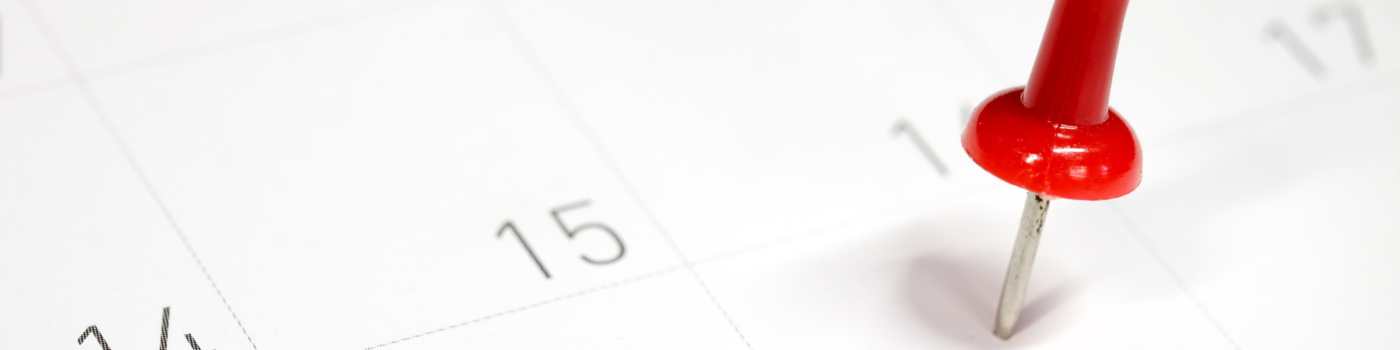 a thumbtack in a calendar