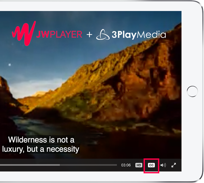 An iPad has a video on screen that utilizes the JW Player. The CC icon is toggled on and captions appear on the screen.