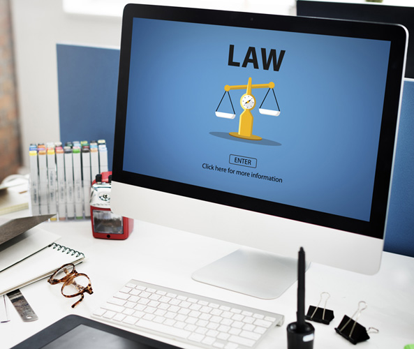 A computer screen with the word LAW and an image of legal scales