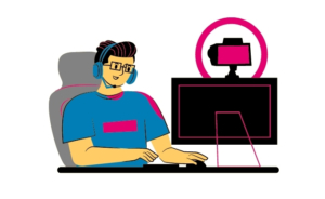Person sitting at computer with a headset & webcam streaming