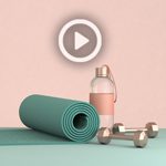 A yoga mat, water bottle, and light weights with a play button over them