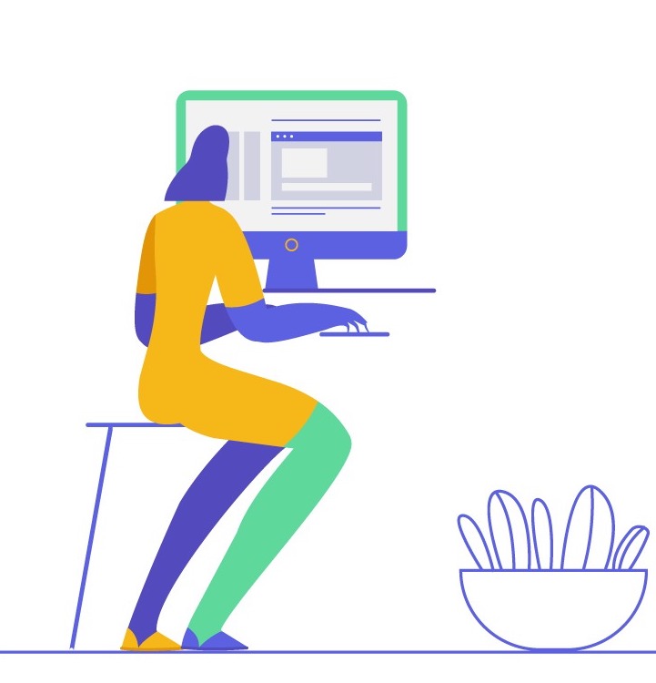 woman sits at a desktop computer.