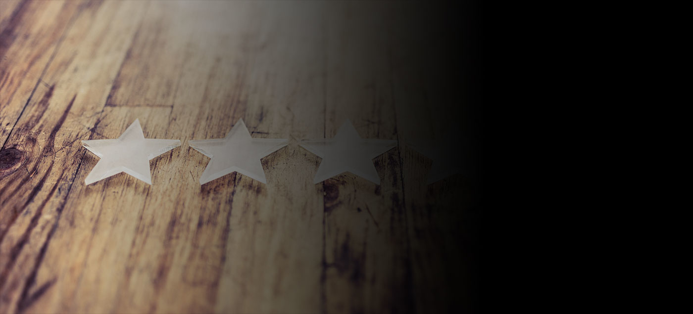 A wooden table with five stars.