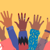 Diverse young people with hands up