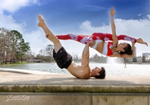 woman and man performing acroyoga
