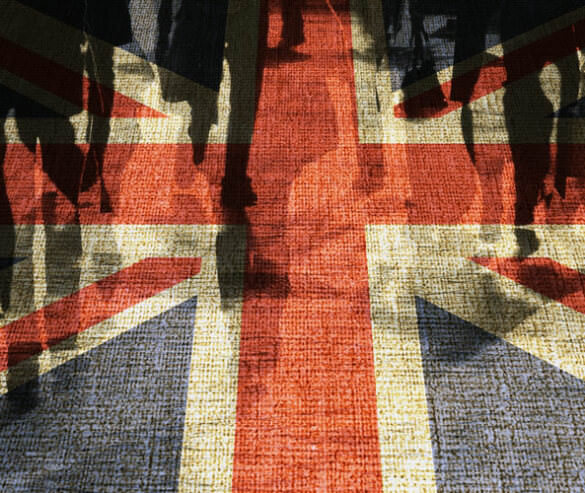 The Union Jack shown among a crowd of silhouettes