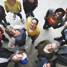 Top-down perspective of a group of people staring up