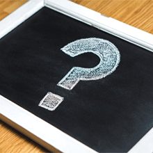 A chalkboard with a question mark drawn on it
